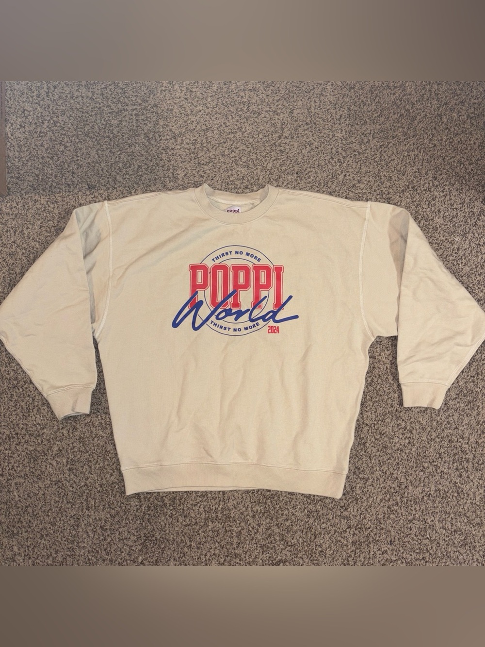 Poppi World Crewneck Sweatshirt. Cream With Red & Blue Logo. Size Medium